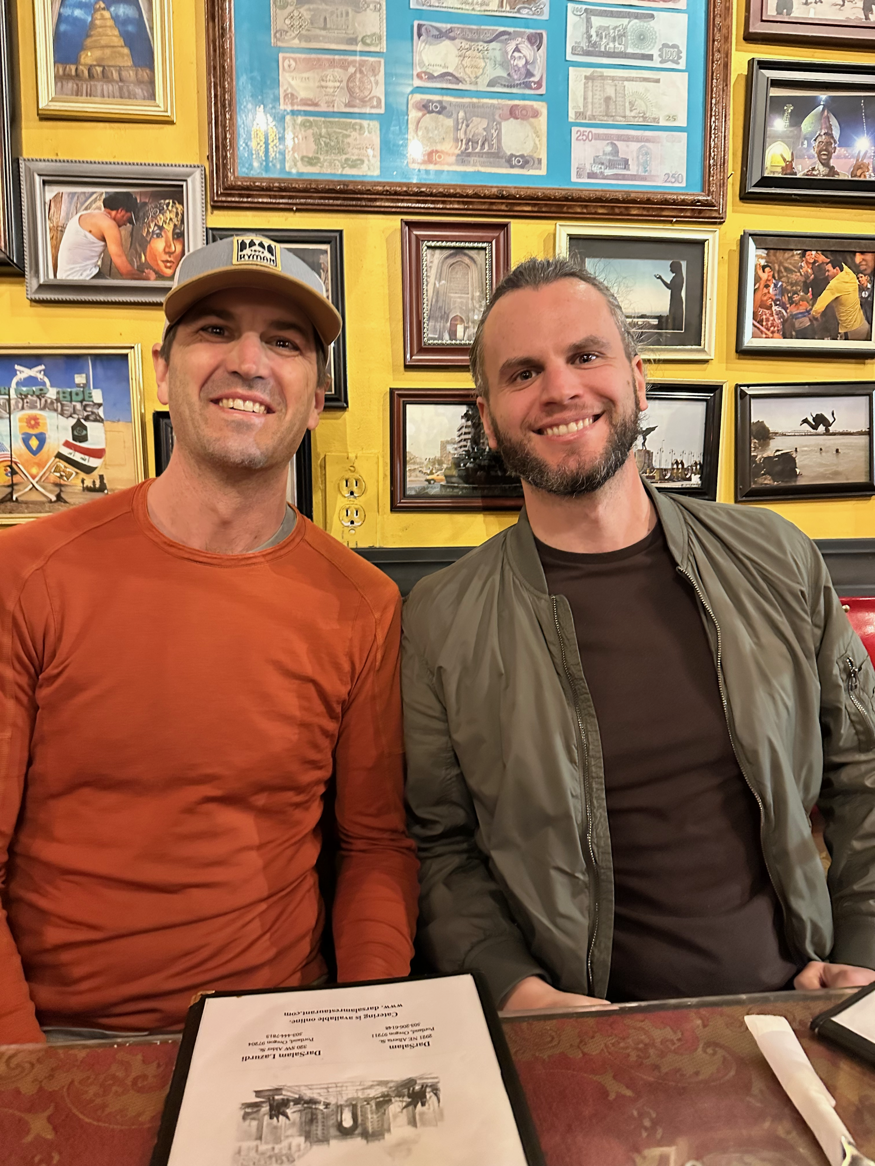 Alex and Mac networking over drinks at MicroConf